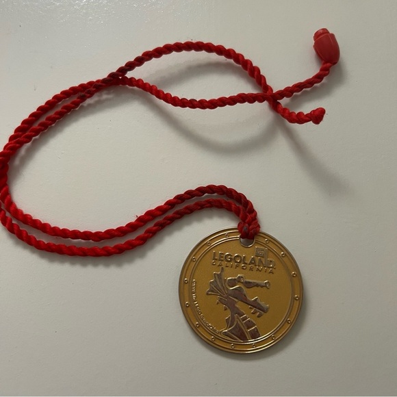 LEGOLAND California Gold Medal with Red Cord - Picture 1 of 4